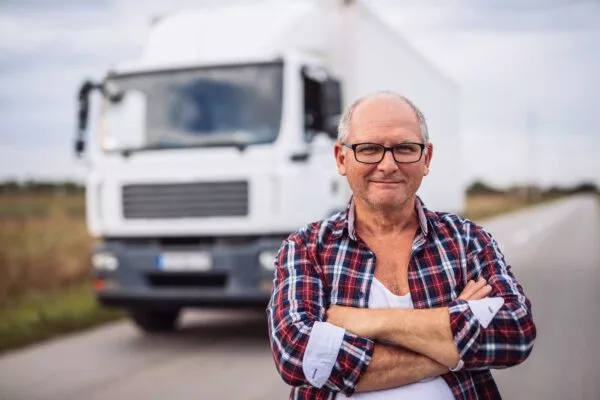 image of a man with a truck in the background